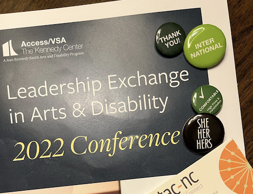LEAD Conference brochure with badges and the TAC business card