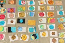 Watercolor planetary postcards created during a professional development workshop